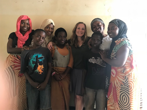 Dr. Amy VanCamp (center) during a home visit with a refugee family